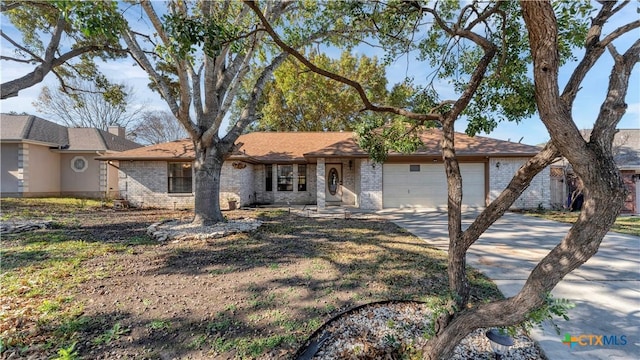 ranch-style home featuring a garage