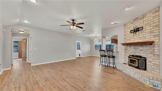 unfurnished living room featuring light wood-type flooring and ceiling fan