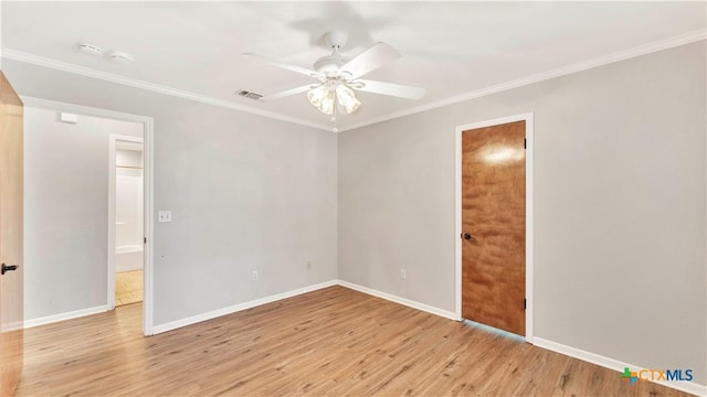 empty room featuring light hardwood / wood-style floors, ceiling fan, and crown molding