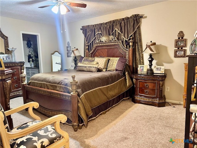 bedroom with carpet flooring, ceiling fan, and a textured ceiling