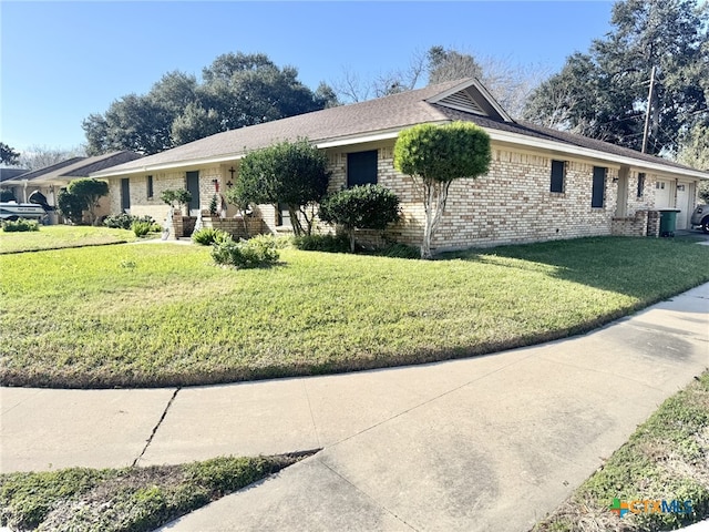 ranch-style home with cooling unit and a front lawn