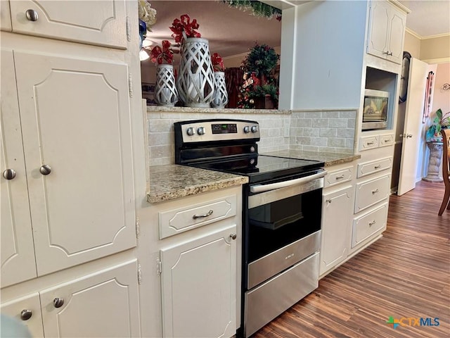 kitchen featuring stainless steel range with electric stovetop, crown molding, tasteful backsplash, dark hardwood / wood-style flooring, and white cabinetry