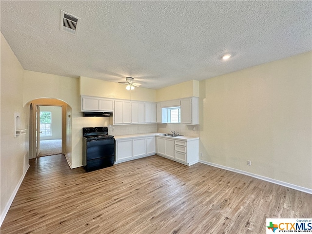 kitchen featuring white cabinetry, black range with electric stovetop, sink, and light hardwood / wood-style flooring