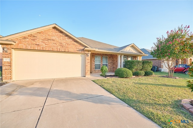 ranch-style home with a garage and a front yard