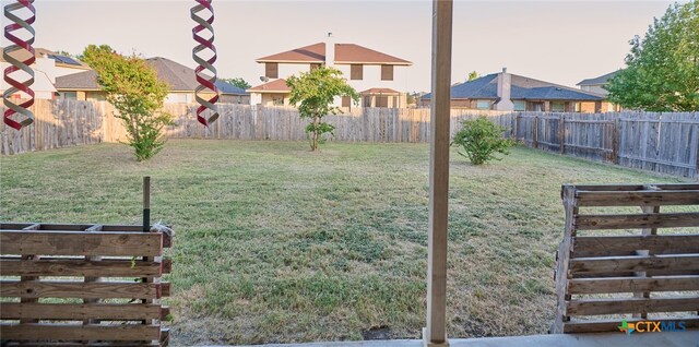 view of yard at dusk