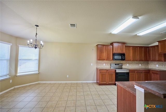 kitchen featuring hanging light fixtures, tasteful backsplash, stainless steel range with electric cooktop, and a notable chandelier