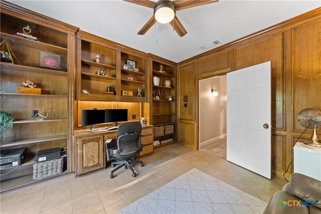 tiled office featuring built in desk and ceiling fan