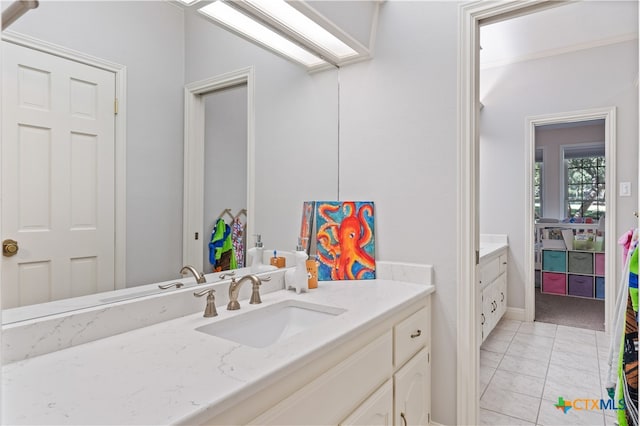 bathroom with vanity and tile patterned floors