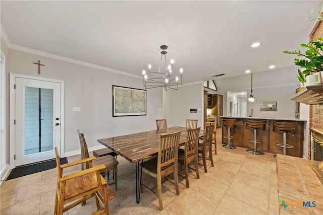 dining area featuring a fireplace, light tile patterned floors, an inviting chandelier, and crown molding