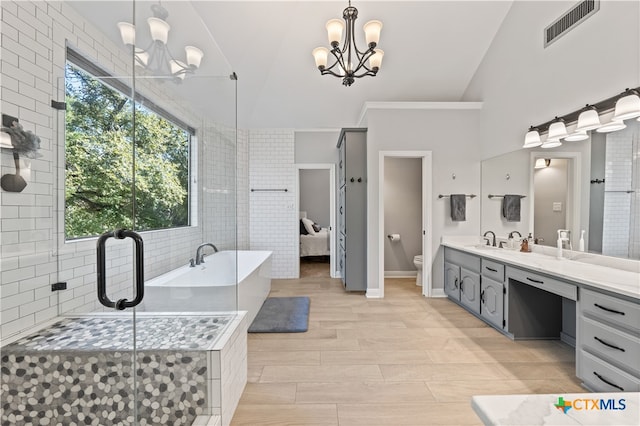 full bathroom with separate shower and tub, hardwood / wood-style floors, decorative backsplash, a chandelier, and vanity