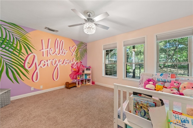 game room with carpet and ceiling fan