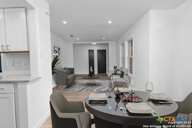 dining space with light wood-type flooring