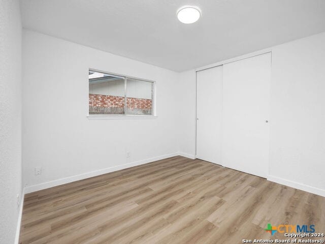 empty room featuring hardwood / wood-style flooring