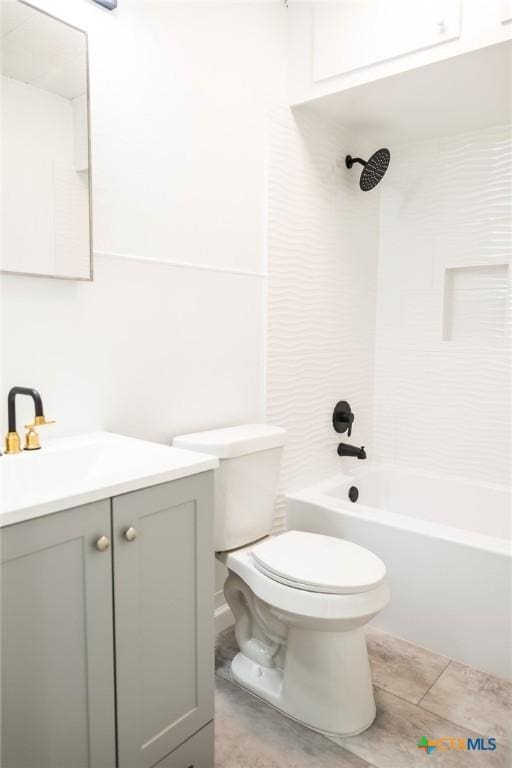 1004 Buena Vista Ave, Victoria, TX 77901 - bathroom featuring toilet, vanity, and shower / washtub combination