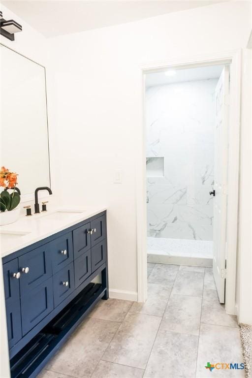 1004 Buena Vista Ave, Victoria, TX 77901 - bathroom featuring double vanity and a marble finish shower