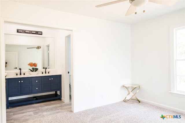 1004 Buena Vista Ave, Victoria, TX 77901 - full bath featuring ceiling fan, double vanity, and baseboards