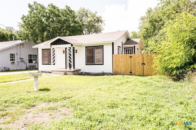 1004 Buena Vista Ave, Victoria, TX 77901 - view of front of house featuring central air condition unit and a gate