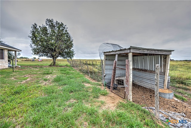 view of outdoor structure featuring a rural view