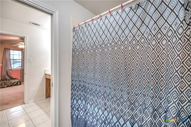 bathroom featuring vanity, ceiling fan, and tile patterned floors