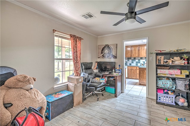 home office featuring ceiling fan and crown molding