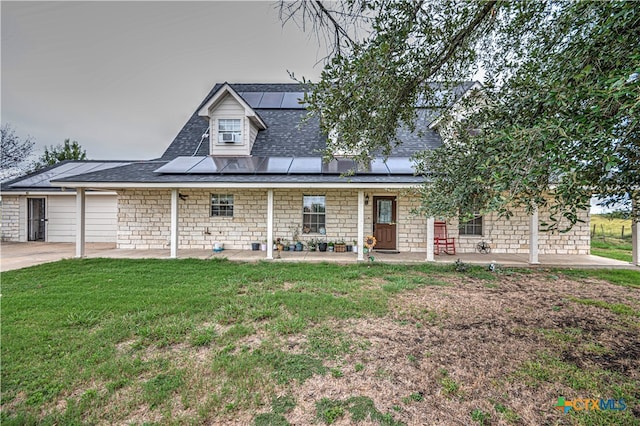 view of front of property with a front lawn and a patio