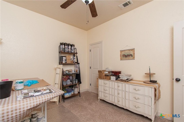 interior space with ceiling fan