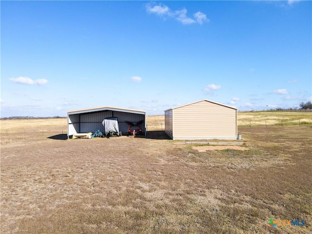 view of outbuilding with a rural view