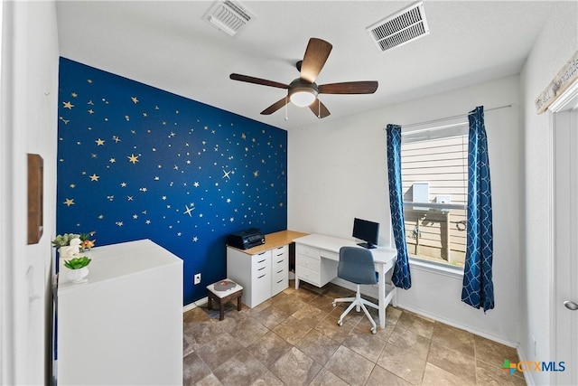 office area with an accent wall, visible vents, baseboards, and wallpapered walls