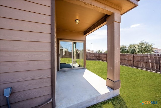 view of patio / terrace featuring fence