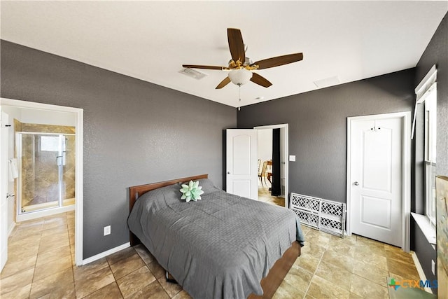 bedroom with baseboards, visible vents, ceiling fan, and a textured wall