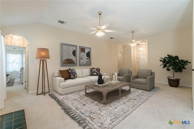 127 Maple Dr, Mountain City, TX 78610 - carpeted living area with a ceiling fan, arched walkways, and lofted ceiling