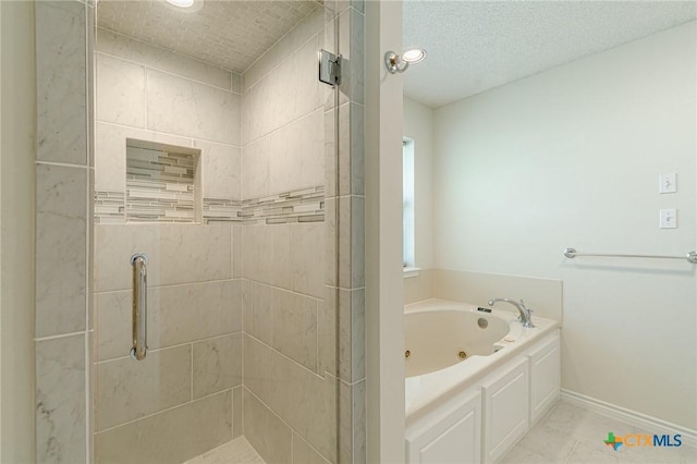 127 Maple Dr, Mountain City, TX 78610 - bathroom with a stall shower, a tub with jets, and recessed lighting
