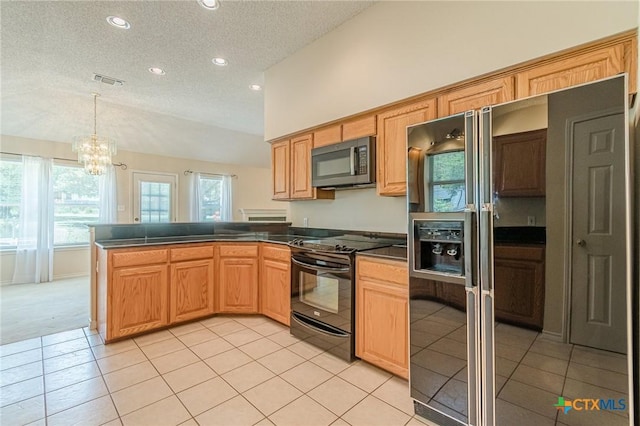 127 Maple Dr, Mountain City, TX 78610 - kitchen featuring black appliances, dark countertops, a textured ceiling, a peninsula, and recessed lighting