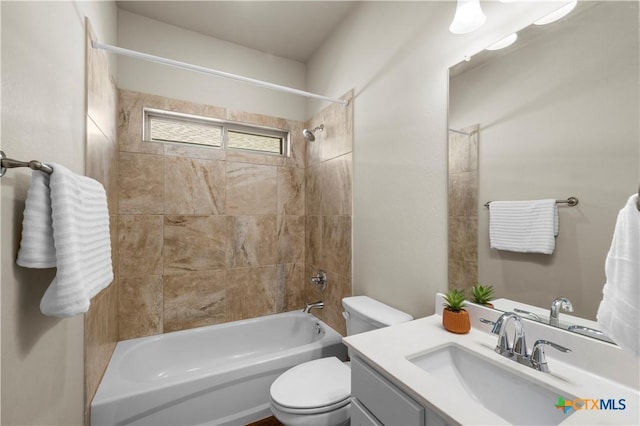 full bathroom featuring toilet, vanity, and shower / bathtub combination