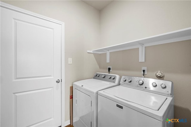 washroom featuring laundry area and independent washer and dryer