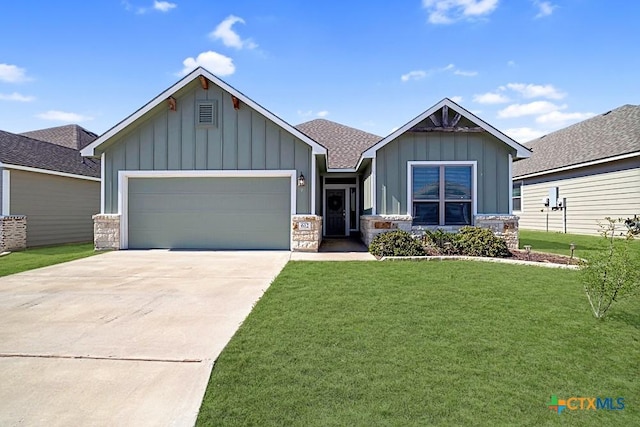 craftsman-style home featuring a garage, concrete driveway, board and batten siding, and a front yard