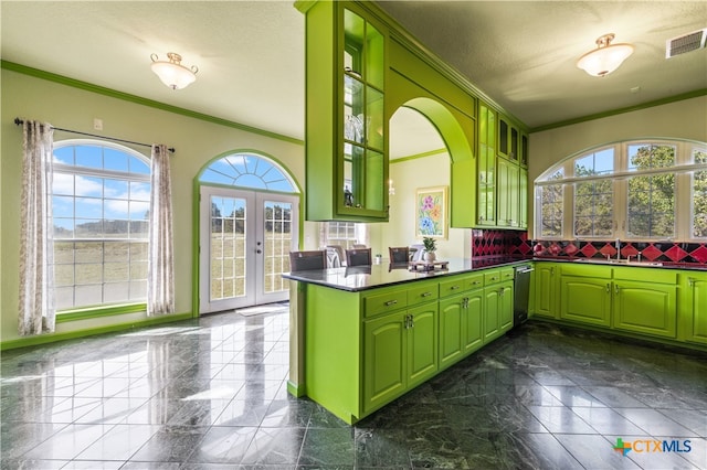 kitchen featuring green cabinets and plenty of natural light