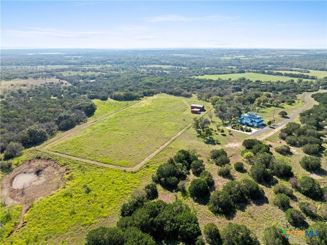 birds eye view of property featuring a rural view