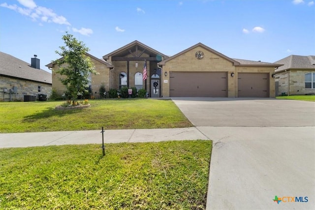 view of front of house featuring central AC unit, a garage, and a front yard