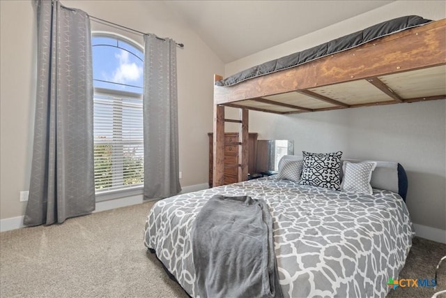 carpeted bedroom featuring lofted ceiling