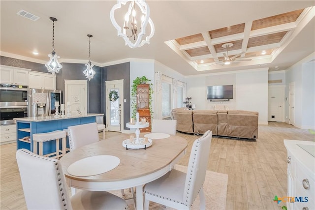 dining space featuring coffered ceiling, ceiling fan with notable chandelier, light hardwood / wood-style floors, crown molding, and beam ceiling