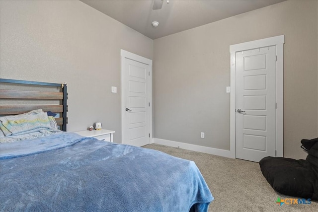 bedroom featuring ceiling fan and carpet floors