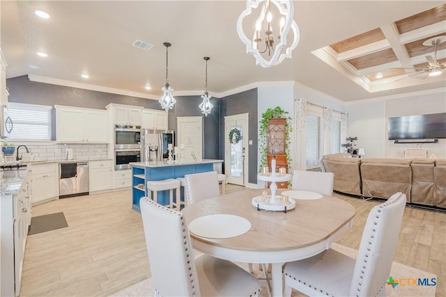 dining space with coffered ceiling, an inviting chandelier, light hardwood / wood-style flooring, beamed ceiling, and crown molding