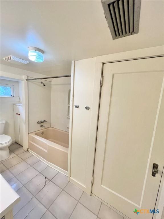 bathroom with shower / washtub combination, visible vents, toilet, and tile patterned flooring