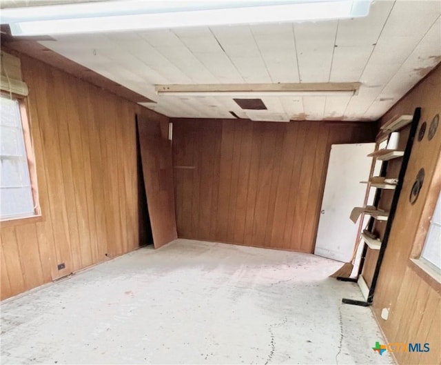 empty room with wood walls