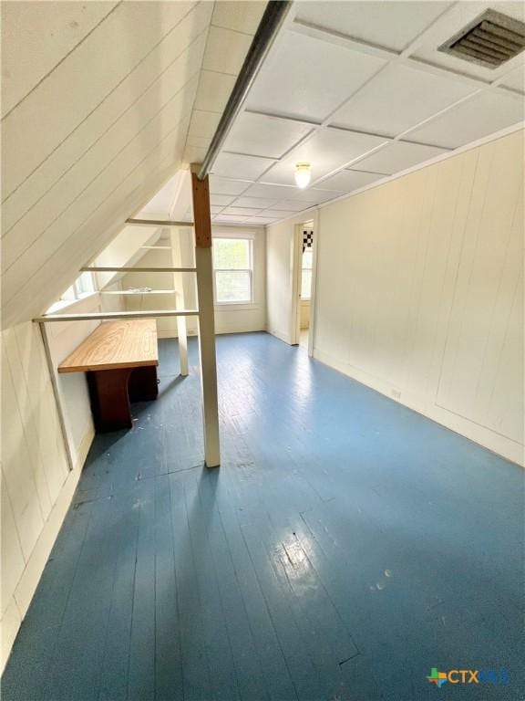 bonus room featuring visible vents and hardwood / wood-style flooring