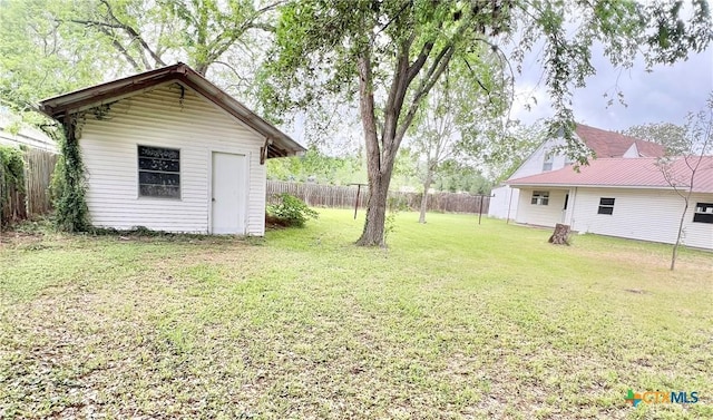 view of yard with an outbuilding and a fenced backyard
