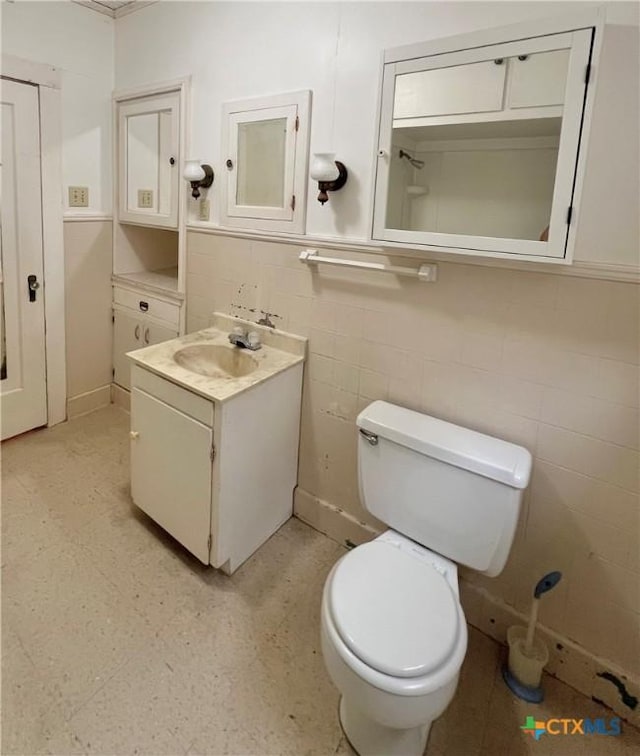 bathroom with toilet and a sink