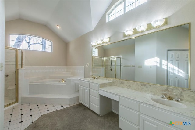 bathroom featuring lofted ceiling, tile patterned floors, separate shower and tub, and vanity