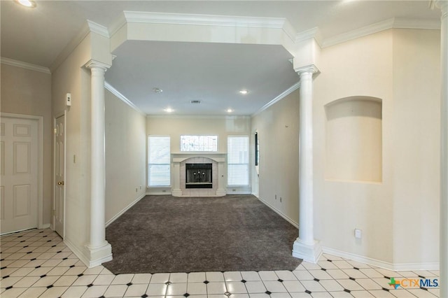 unfurnished living room featuring a tiled fireplace, ornamental molding, and light colored carpet